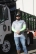 Andy Vila standing with an ACV Junk Removal truck