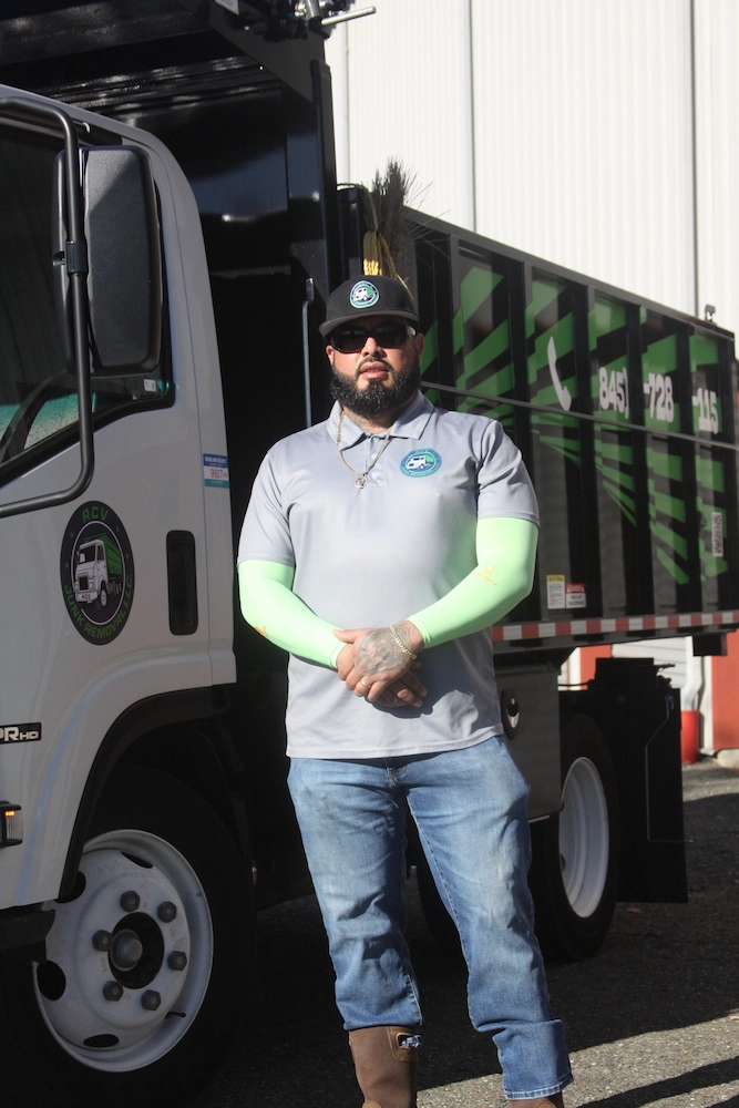 Andy from ACV Junk Removal standing by the truck
